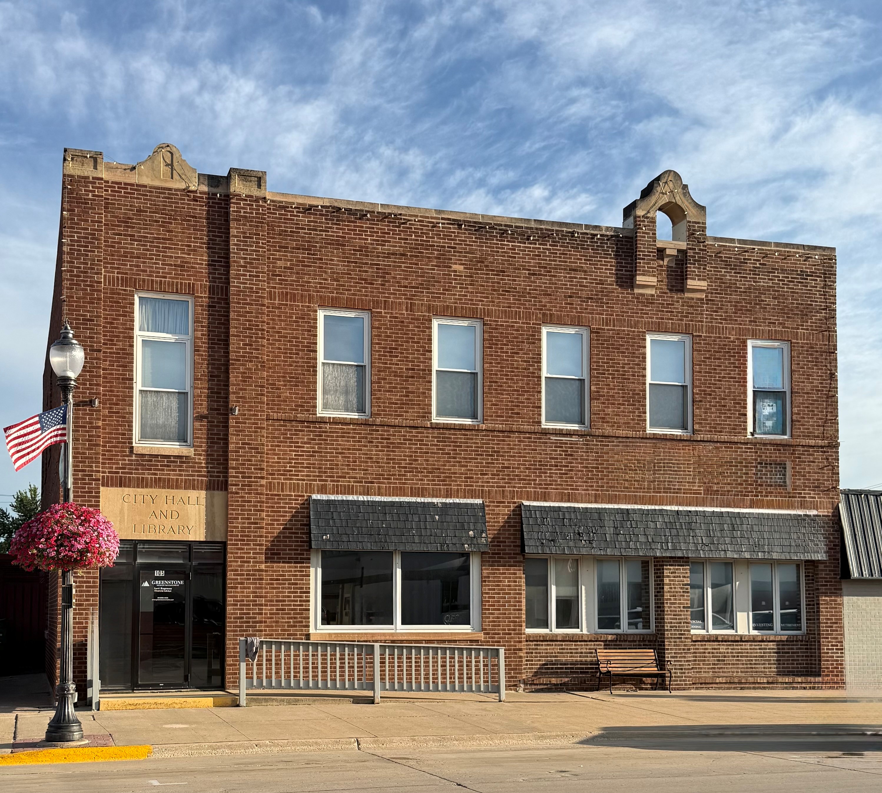 Photo of the Lake Mills Town Hall and Library from 1925. Two Story Brick Building on Main Street.